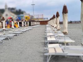 Bathhouse beach club preparation set up for summer season in Italy photo