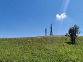 telecom cellular Communication Antenna tower on blue background photo