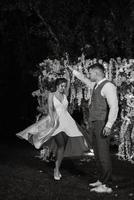 couple of newlyweds on the evening illuminated arch photo