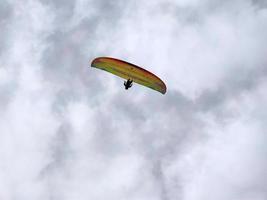 paraglider on cloudy sky photo