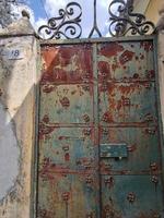 old rusted metal door fence photo