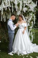 wedding ceremony of the newlyweds on the glade photo