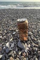 rusted can on the beach photo