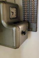 old clock work badge check machine photo