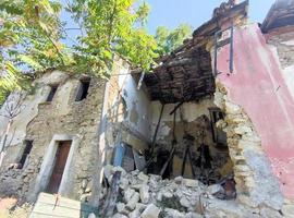 old abandoned roof collapsed farm house building in italy photo