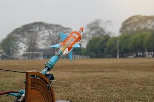 water rocket on launch pad. It is an activity that promotes science knowledge and skills for children. Children have thinking skills, problem-solving, creativity, happiness, and fun. photo