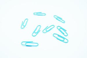 blue paperclips in white background photo