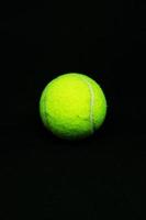 A Tennis Ball on Black Background photo