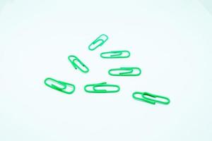 green paperclips in white background photo