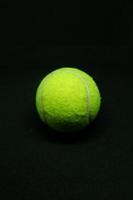 Tennis Ball in a Dark Background photo