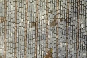 Tiles on wall. Mosaic tile. Pattern of shards of colored stone. photo