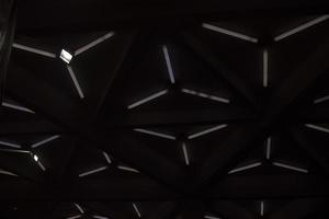 Triangular lamps on ceiling. Modern architecture. Light design. photo