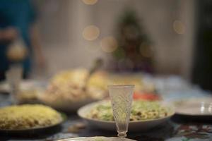 Glass of vodka on table. Festive table. Glass for alcoholic beverage. photo