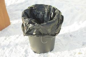 Trash. Bag in bucket. Place for waste. photo