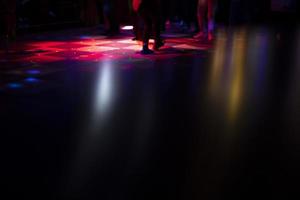 Disco in bar. Color music on dance floor. Bright colors in night club. photo