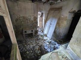 old abandoned roof collapsed farm house building in italy photo