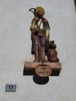 Saint ROch Rocco dog patron protector saint statue in Grondona medieval village italy photo