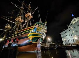 amsterdam canal ship museum at night view photo