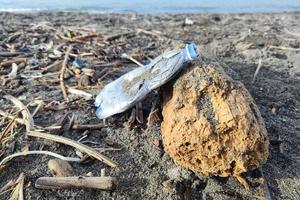 Plastic waste rubbish garbage on the beach photo