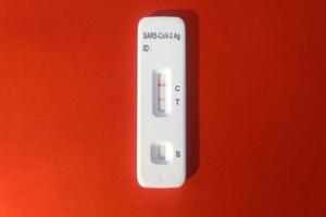 Covid rapid test kit positive result photo