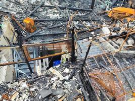 burned metal structure after fire by the sea photo