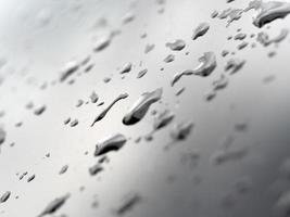 rain water drops on blue metallic surface photo