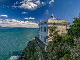 Portofino historic lighthouse by the sea photo