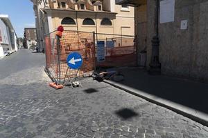 ROME, ITALY - JUNE 16 2019 - via del corso homeless bagger sleeping in the street photo