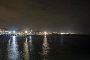 Ostia Rome Italy sea promenade at night view from pier photo