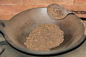 hand toasted coffee seeds in Bali, Indonesia photo