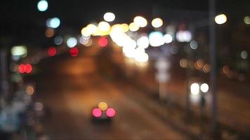 Blur night colorful light of traffic and vehicle on main road and drive entry to the city video