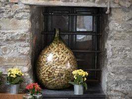 many wine cork inside glass jar photo