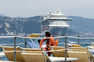 A cruise ship very close to the beach in Santa Margherita Italy photo