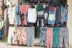 Vintage clothes for sale inside a shop photo