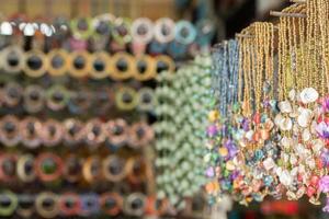 Bracelets in indonesia market on display stand photo