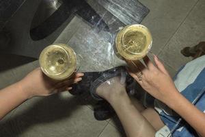 female hand holding champagne glass photo