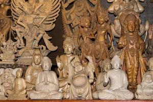 Buddha carved statue at the market in indonesia photo