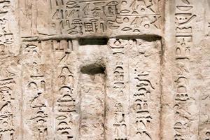 ancient hieroglyphs on stone detail photo