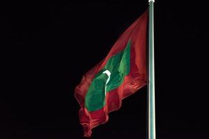 maldives flag while weaving at night photo