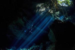 Cave diving in mexico cenote photo