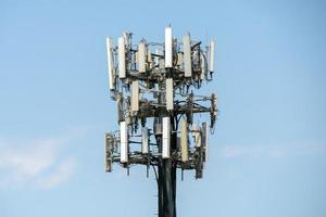 communication antenna on light blue sky photo