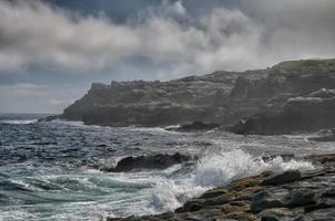 sea in tempest on rocks photo