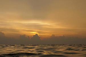 A colorful sunset in the middle of indian ocean in Maldives photo