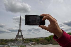 Hand taking selfie at Paris tour eiffel photo