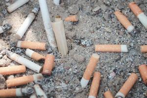 cigarette butts combined in a cigarette disc Concept of many cigarette debris after smoking photo