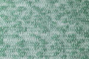 Bright green white melange knitwear wool fabric texture background. Abstract textile backdrop photo