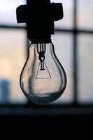 A light bulb over the dark background photo