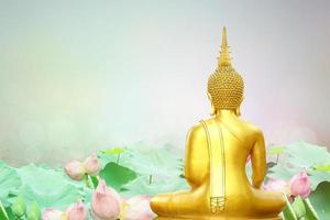 Makha Asanaha Visakha Bucha Day Golden Buddha image. Background of Bodhi leaves with shining light. Soft image and smooth focus style photo