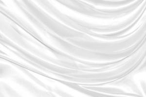 Closeup elegant crumpled of white silk fabric cloth background and texture photo