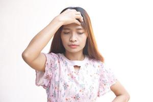 Asian woman having a headache from work photo